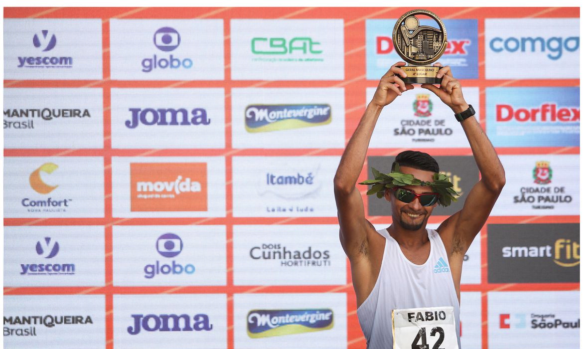 Fabio Jesus celebrates as he finished fourth in the men's race at the annual 